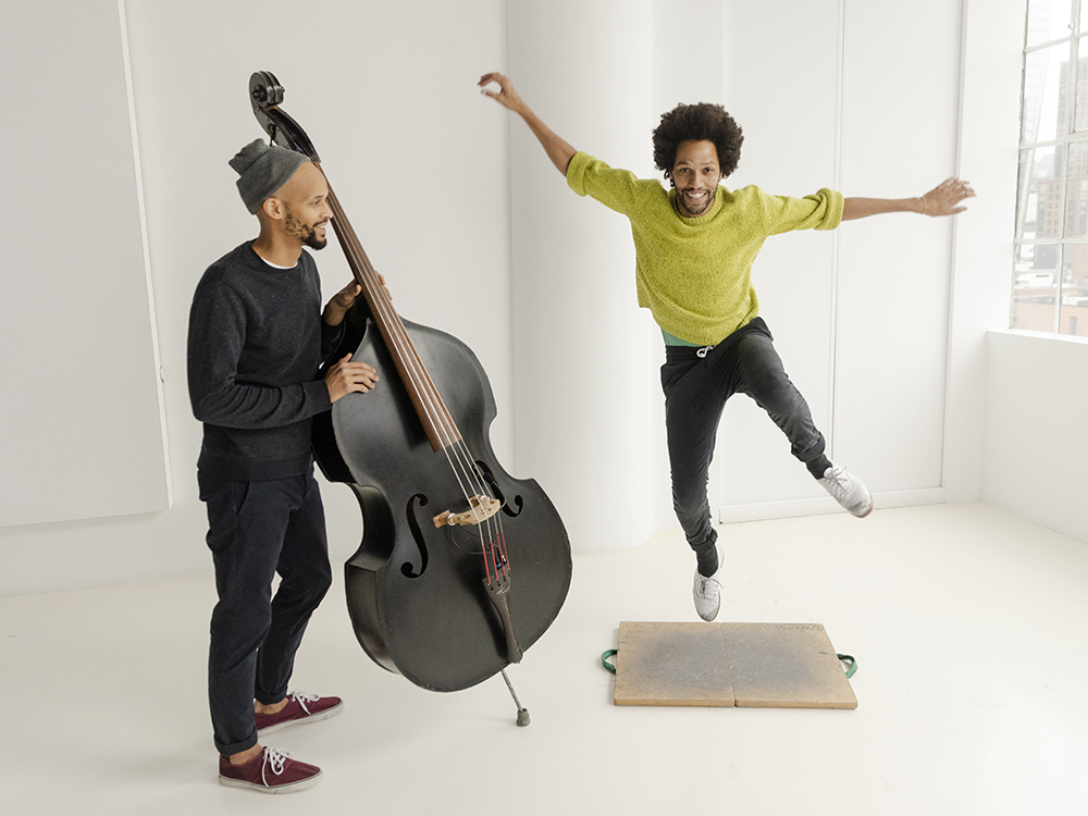 Leonardo Sandoval tap dancing and jumping next to a cellist.